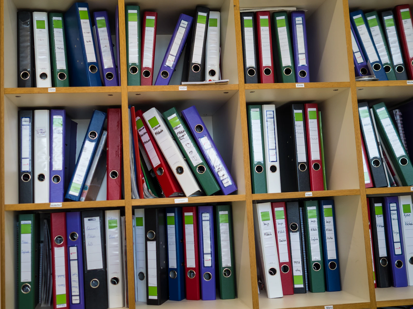 Shelves filled with colorful binders and folders